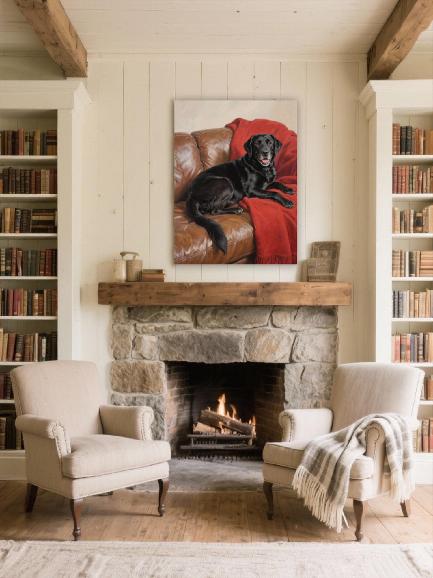 a cozy living room with a fireplace, two armchairs, and a large framed painting of a black dog on a red blanket hanging above the fireplace.