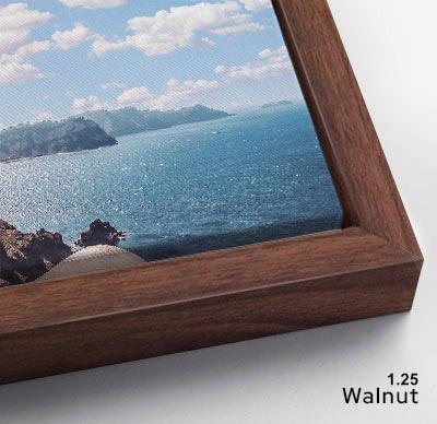 The image is a framed photograph of a scenic ocean view, with a wooden frame surrounding the picture.