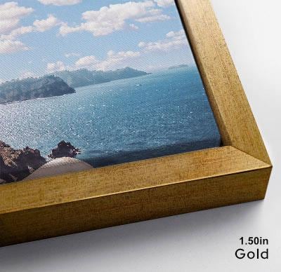 The image is a framed photograph of a scenic ocean view, with a rocky coastline and a clear blue sky in the background.