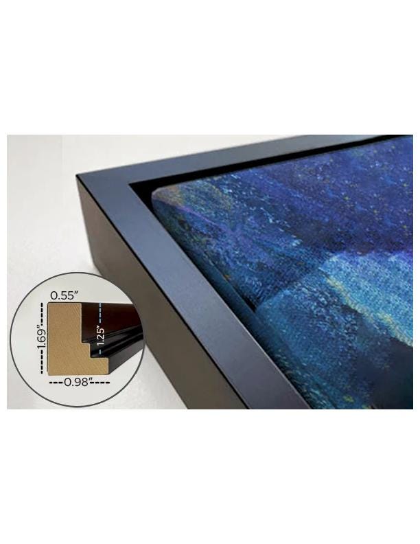 a close-up view of a framed artwork with a dark blue and black color palette, possibly depicting a night sky or a landscape.
